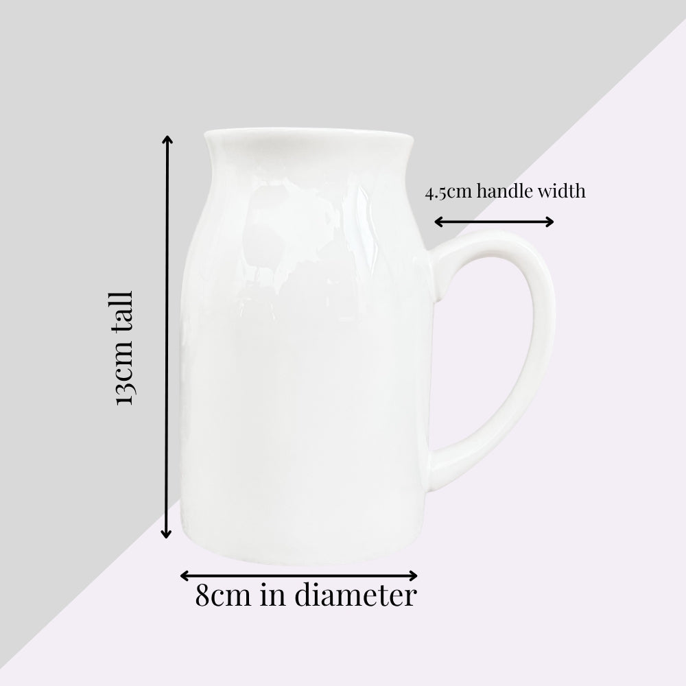 White ceramic vase with handle, dimensions 13cm tall and 8cm diameter shown